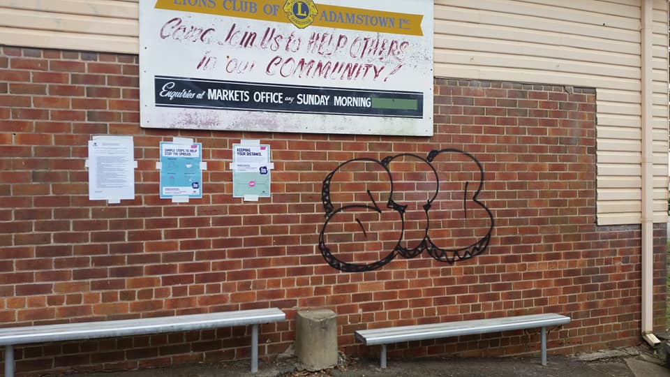 Graffiti on a brick wall on a Torquay commercial building