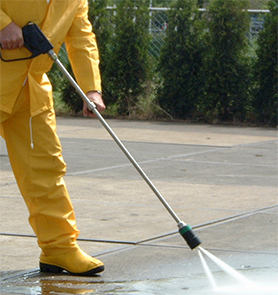 A commercial building in Geelong having pressure cleaning service done to it in order to remove the graffiti